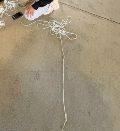 The bungee cord device laid out on the floor